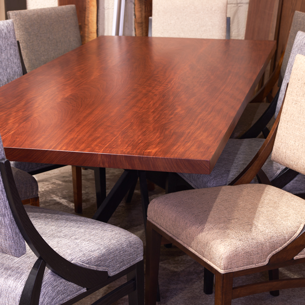 Solid wood Bubinga wide plank style dining table with RH Yoder Korbyn side chairs in our Dining Table Showroom