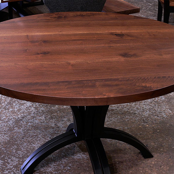 Custom Made Round Walnut Dining Table with Inverted Double Arch Table Base in our Dundee, IL Showroom