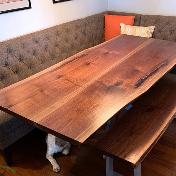 Black Walnut Live Edge Dining Table, Mirror-Image Book Match with Spider Base for Banquette Eating Area, Shown with Matching Bench and the Family Dog's Paw