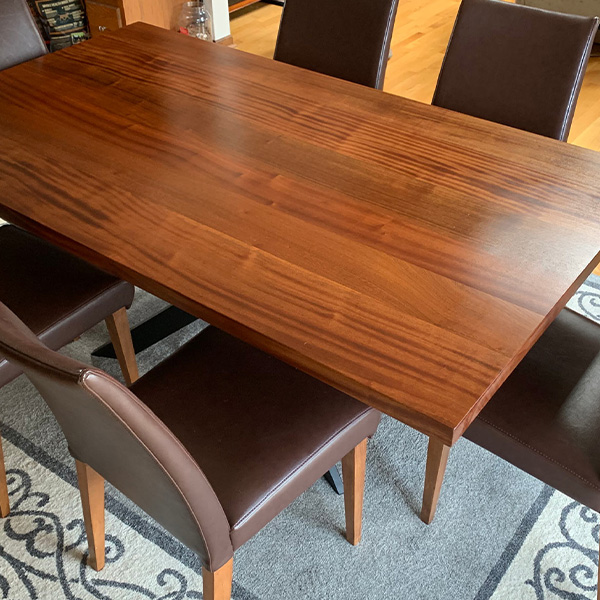 Wide Plank Sapele Mahogany Dining Table in Ribbonstripe Grain with Spider Base and Leather Chairs