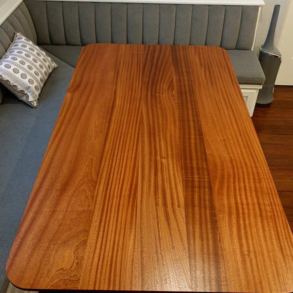 Wide Plank Sapele Table Top with Reverse Knife Edge on Mid Century Style Tulip Base for Chicago North Shore Clients