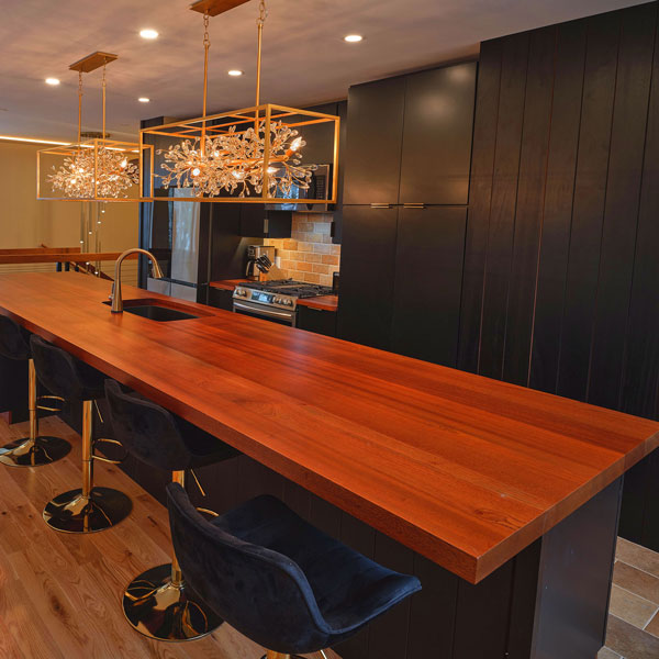 New Construction Sapele Kitchen, Cabinets, Ebonized Wall Cladding and Custom Counter and Island Tops