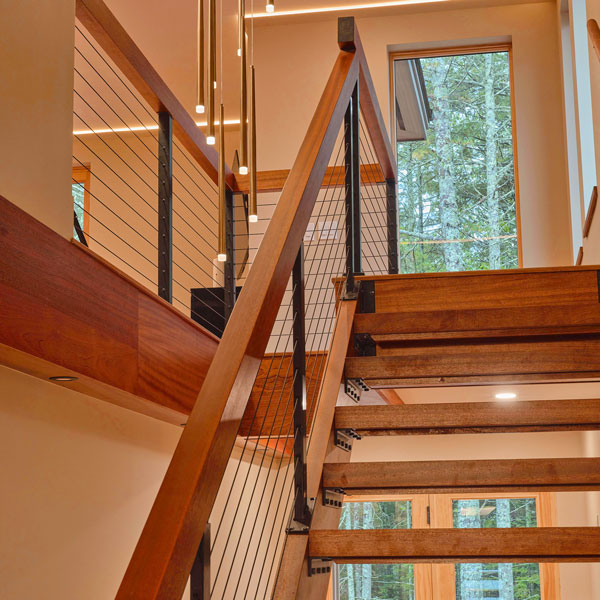 Custom Sapele Open Stairs with Treads, Stringers, Solid Wood Rail and Cable System