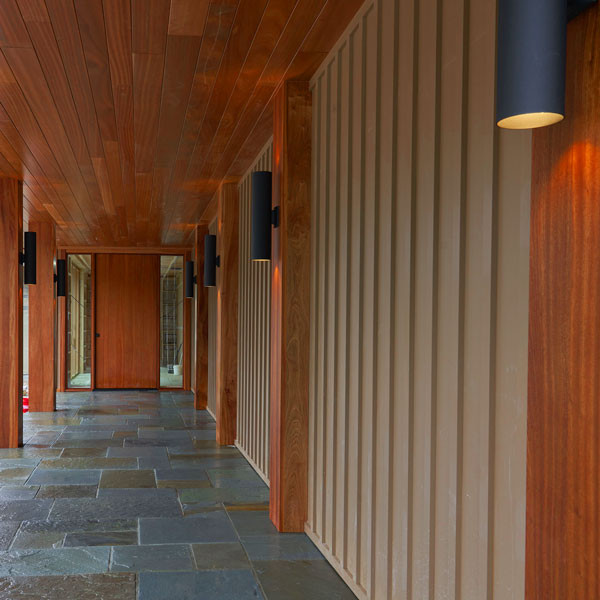Solid Sapele Half Columns, 14 Inch Square Post Wraps and Custom Pivot Door in Entrance