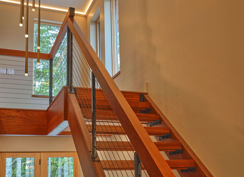 Custom Sapele Open Stairway with Treads, Stringers, Rails and Custom Flush Fit Powdercoated Brackets.