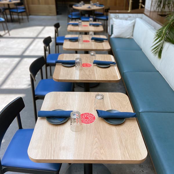 Custom two top White Oak tables for Chicago Hotel restaurant