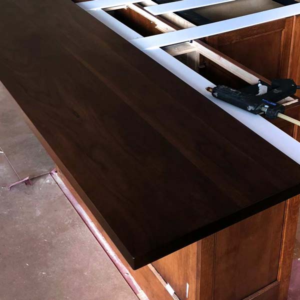 Installation of Dark Walnut Stained Mitered Sapele Mahogany Bar Top for Chicago Area Residence