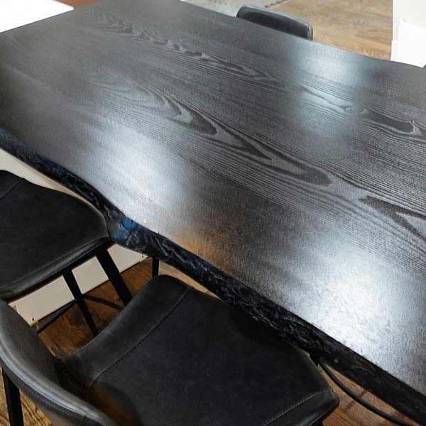 Custom Ebonized Ash Kitchen Island Top Spanning Cabinets, Fabricated from Live Edge Slabs
