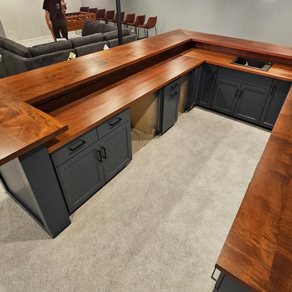 Stained Makore Bart and Countertops, Mitered, Multi-Level Surfaces with Sink Cutout for Chicago Area Basement Rehab