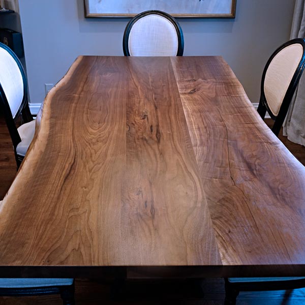 Three Slab style Black Walnut live-edge dining table with RH Yoder dining chairs for Chicago, IL client