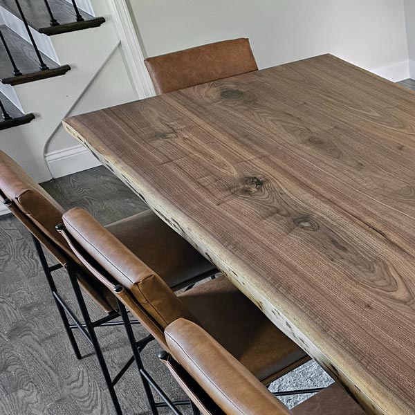 Black Walnut natural edge dining table for Highland Park, IL client