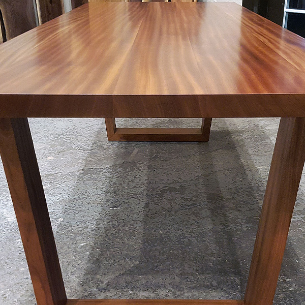Solid wood Sapele Mahogany wide plank style dining table with hardwood mid century trapezoid legs