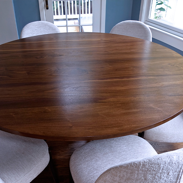 60 inch Diameter Round Dining Table in Stained Makore Hardwood with Steel Pedistal Base for Maximum Seating