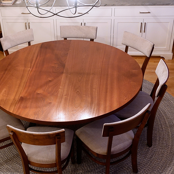 72 inch Diameter Round Dining Table in Clear Coated Sapele Mahogany with Double Arc Steel Legs and RH Yoder Emerson Side Chairs