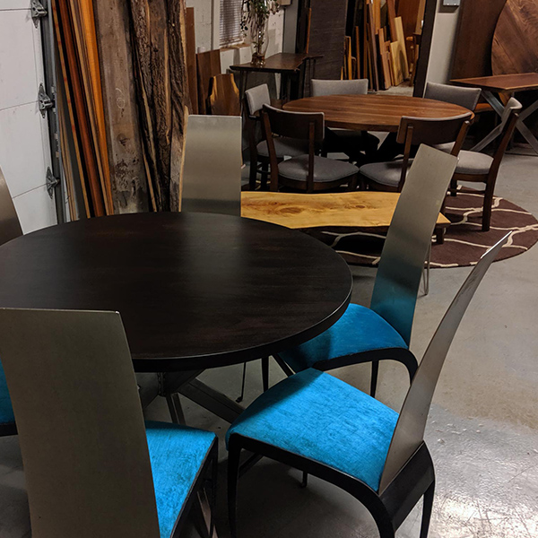 Solid Wood Round Walnut and Mahogany Tables in our Suburban Chicago Area Showroom