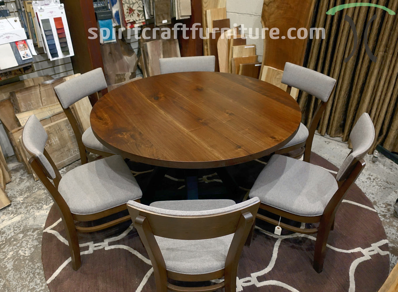 https://spiritcraftfurniture.com/img/round-tables/round-66-inch-black-walnut-table-with-RH-Yoder-Emerson-chairs-and-hourglass-base.jpg