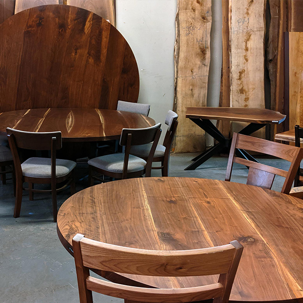 Black Walnut Custom 72 inch Round Dining Table with Custom Base and RH Yoder Emerson Chairs in Chicago, Illinois Area Furniture Showroom