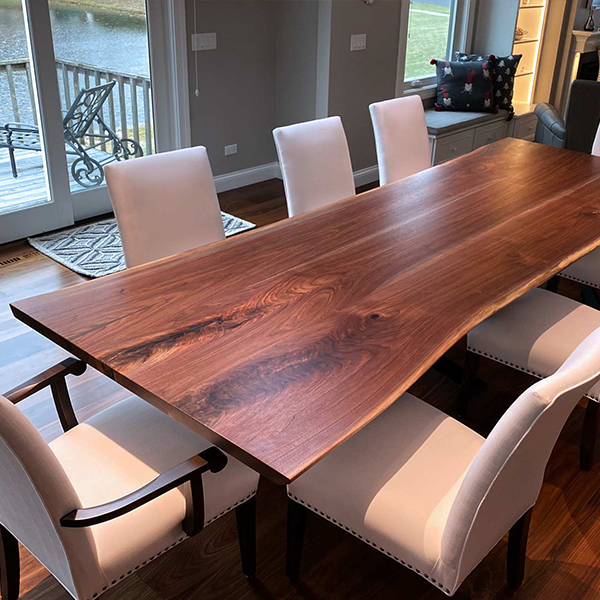 144 inch Long Walnut Live Edge Table in Open Concept Dining Area with Spider Base in Chicago Suburbs, Illinois