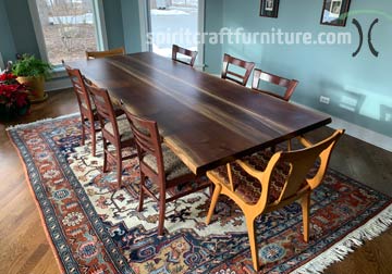 Live edge dining table in 3 slab solid Black Walnut live edge slabs on center base in Chicago area, East Dundee, Illinois