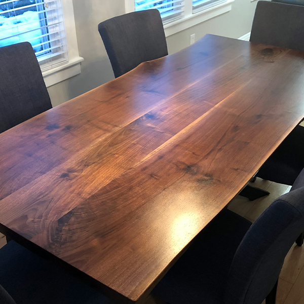 96 inch x 38 inch Live Edge Walnut Three Slab Dining Table with Spider Base and Upholstered Chairs