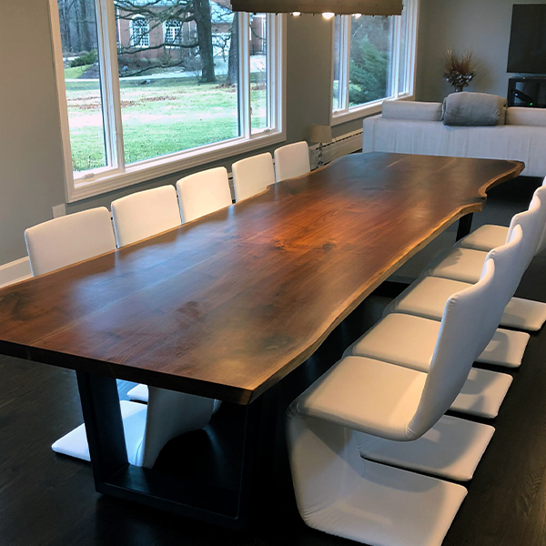 144 inch Live Edge Walnut Dining Table with 2 inch by 4 inch Steel Trapezoid Legs for Chicago Area Client