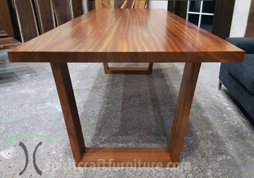Mid Century Modern Style Sapele Mahogany dining table with hardwood trapezoid legs for Chicago area client by Spiritcraft Furniture in East Dundee, Illinois.