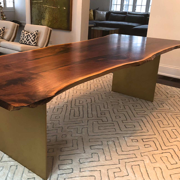 Live Edge Black Walnut Dining Table with Powder Coated Steel Plate Legs in Chicago Area Residence