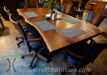Walnut Live Edge Three Slab Dining Table with Wavy "Organic" Edge and RH Yoder Somerset Arm Chairs with Optional Swivel Lift Bases and Indigo Leather Seats.