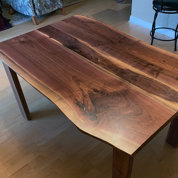 Live Edge Walnut Three Slab Dining Table, Random Organic Look with Sapwood Visable in Center. Shown with Open U Shaped Hardwood Legs for Maximum Seating.