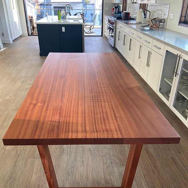 Ribbonstripe, Quarter sawn Sapele Mahogany Dining Table with Solid Wood Mitered Trapezoid Legs, Set Up in Chicago Area Home